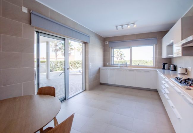 Spacious kitchen with access to the outdoor area.